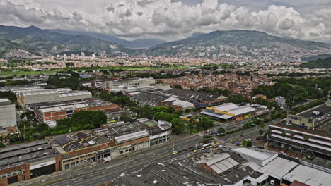 Medellin-Colombia-Aerial-v15-drone-flyover-Campo-Amor,-Santa-Fe-and-Trinidad-neighborhoods-capturing-airport-runway,-urban-cityscape-and-mountainous-landscape---Shot-with-Mavic-3-Cine---November-2022