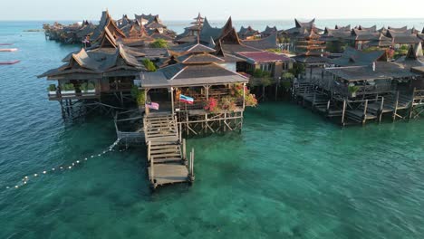 Luxury-wooden-houses-build-on-water-in-Malaysia-in-Mabul-Island,-Pan-right