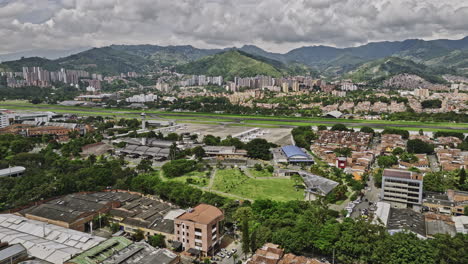 Medellin-Colombia-Aerial-v16-low-flyover-and-around-Santa-Fe-and-Campo-Amor-Guayabal-capturing-domestic-airport-and-urban-cityscape-with-mountainous-background---Shot-with-Mavic-3-Cine---November-2022