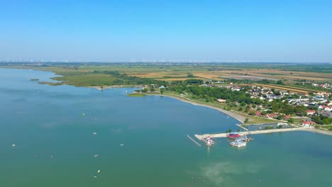 Aerial-View-Of-Podersdorf-Lighthouse-And-Pier-In-Neusiedlersee,-Podersdorf-am-See,-Austria