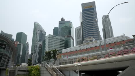 Looking-Up-At-Fullerton-Hotel-With-Financial-Downtown-Skyline-Near-Merlion-Park-In-Singapore