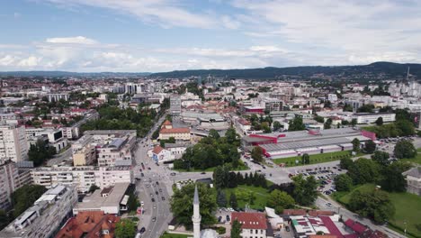 Aerial-dolly-out-cityscape-Banja-Luka-establisher-mosque-Ferhadija-on-sunny-day