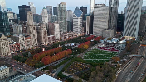 Aerial-view-around-the-fall-colored-Millennium-park,-autumn-sunrise-in-Chicago