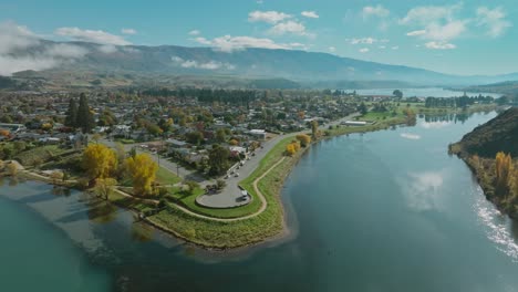 Aerial-drone-view-of-Cromwell-town-nestled-at-the-edge-of-idyllic-Lake-Dunstan-in-Central-Otago-region-of-South-Island,-New-Zealand-Aotearoa