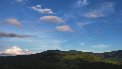 Rainbow-In-Blue-Sky-Over-Green-Jungle-In-Tropical-Costa-Rica,-4K-Resolution-Drone