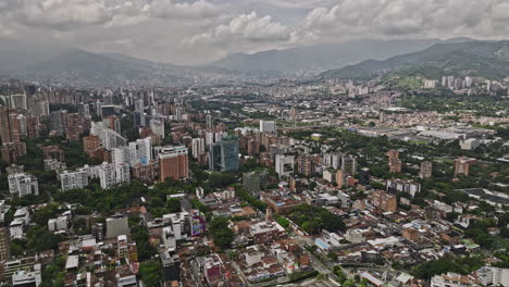 Medellin-Colombia-Aerial-v11-drone-flyover-Lalinde-capturing-cityscape-of-El-Poblado,-Patio-Bonito,-Astorga,-Guayabal-and-Campo-Amor-and-mountainous-landscape---Shot-with-Mavic-3-Cine---November-2022