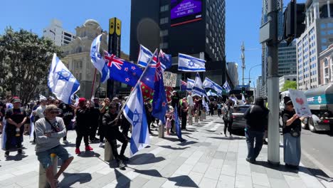 Demonstrators-waving-Israel-and-New-Zealand-flags-at-protest-in-Auckland-CBD