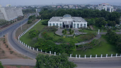 General-Shehu-Musa-Yar'-Adua-Centre-in-Abuja,-Nigeria---pullback-aerial