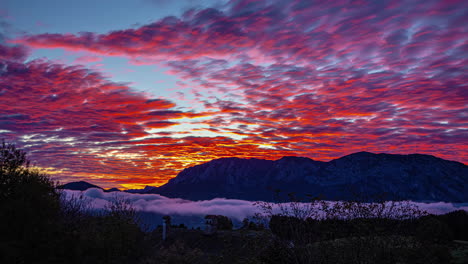 Brilliant-sunset-time-lapse-with-low-lying-fog-in-the-valley