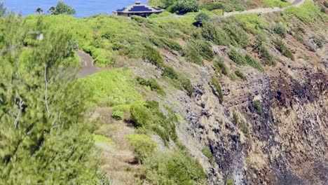 Cinematic-long-lens-panning-shot-of-the-Kilauea-Point-Lighthouse-along-the-northern-coast-of-Kaua'i-in-Hawai'i