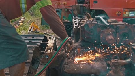 Sparks-Fly-in-Slow-Motion-as-Filipino-Man-Grinds-Scrap-Metal