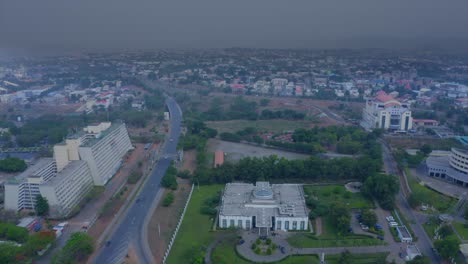 Shehu-Musa-Yar'-Adua-Centre-in-Abuja,-Nigeria---descending-aerial-view-on-a-smoggy-day