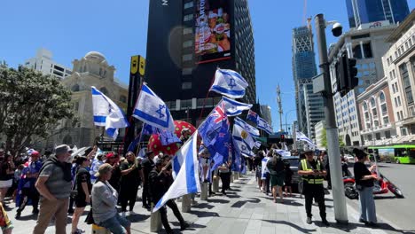 Protestors-gather-for-a-pro-Israel-demonstration-in-the-city-square,-slow-motion