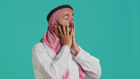 Middle-eastern-guy-deals-with-migraine