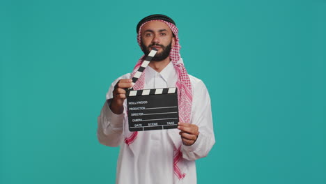 Islamic-adult-with-clapperboard