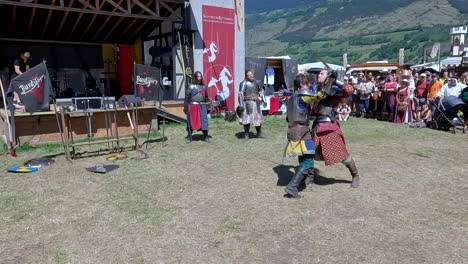 A-sword-fighting-scene-performed-by-Burdyri,-a-professional-sword-and-stage-combat-team,-during-the-South-Tyrolean-Medieval-Games-2023