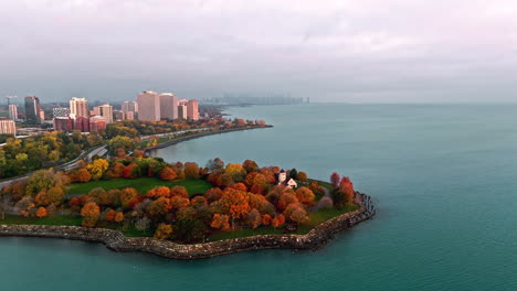 Drone-shot-of-tilting-toward-the-Promontory-Point,-autumn-sunrise-in-Chicago