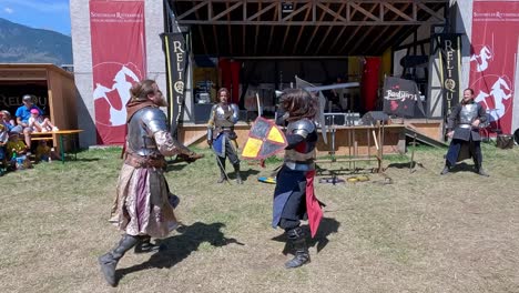 A-fighting-scene-with-weapons-performed-by-Burdyri,-a-professional-sword-and-stage-combat-team,-during-the-South-Tyrolean-Medieval-Games-2023