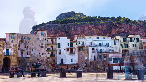 Timelapse-shot-of-people-gathering-in-an-old-town-square-surrounded-by-tall-buildings-along-the-Sicilian-coast-in-Italy-at-daytime