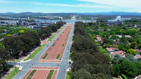Drone-aerial-pan-shot-of-Parliament-house-road-street-cars-capital-hill-Lake-Burley-Griffin-Canberra-ACT-Australia-travel-tourism-politics-4K