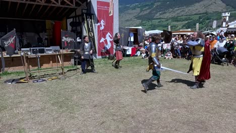 A-fighting-scene-with-weapons-performed-by-Burdyri,-a-professional-sword-and-stage-combat-team,-during-the-South-Tyrolean-Medieval-Games-2023
