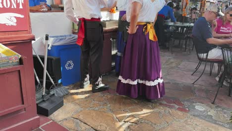 Traditional-Mexican-costumes-in-Old-town-San-Diego,-male-and-female-in-a-restaurant