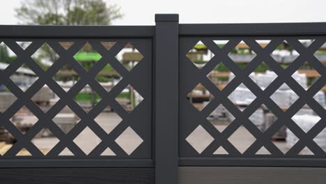Close-up-of-fence-panel-design-with-square-diamond-cut-outs-creating-a-luxury-look-on-dark-grey-plastic-for-modern-look