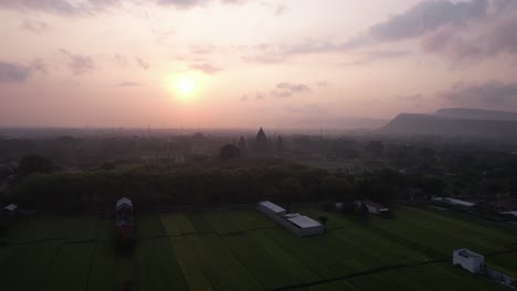 Aerial-view-of-sunset-and-silhouette-of-Prambanan-Temple,-a-Hindu-temple-in-Indonesia