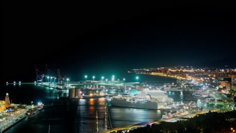 Night-lapse-of-the-port-and-coastline-of-Malaga,-Spain