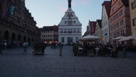 Open-air-marketplace-and-city-center-as-families-gather-to-eat,-Rothenbrug-ob-der-Tauber-Germany