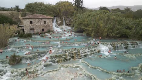 Cinematic-Establishing-Drone-Shot-of-Saturnia-Thermal-Bath-Pools-in-Italy