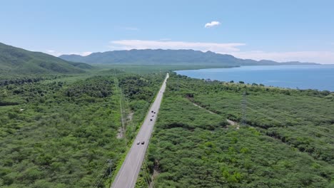 Scenic-long-road-through-tropical-rainforest-lane-on-Caribbean-island,-drone