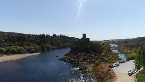 Aerial-view-of-the-Almourol-Castle-surrounded-by-water-and-greenery-in-Portugal