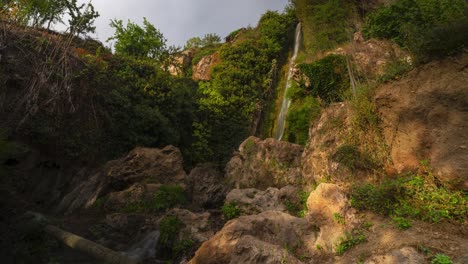 Las-Chorreras-waterfall-surrounded-by-green-and-lush-plants,-time-lapse