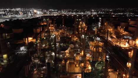 Oil-refinery-at-nighttime---aerial-flyover
