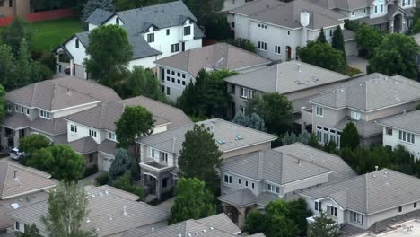 Aerial-view-of-a-suburban-neighborhood-with-multi-story-houses-and-greenery