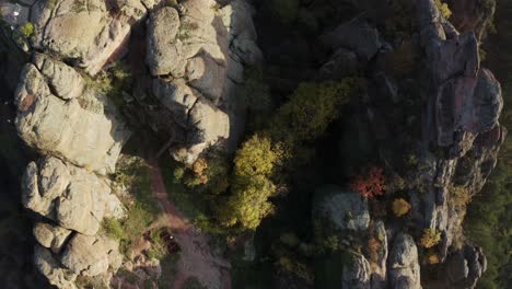 Overhead-drone-shot-of-the-natural-rock-sculptures-of-Belogradchik,-situated-west-of-the-town-of-Belogradchik,-at-the-foothills-of-the-western-Balkan-mountain-ranges-in-Bulgaria