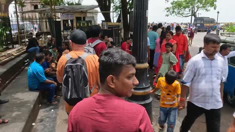 Mumbai,-India---20-August-2023:-Tourists-and-locals-walking-along-the-footpath-outside-the-Gateway-of-India-and-the-Taj-Palace-Mumbai