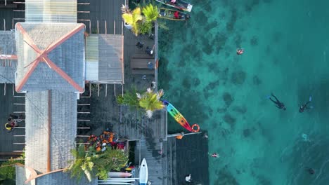 Elevated-view-of-village-on-Celebes-sea-water-in-Mabul-Island,-Malaysia
