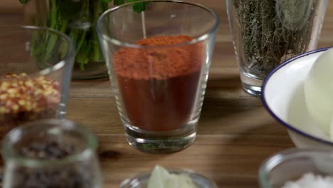 Various-ingredients-for-a-delicious-chimichurri-sauce-are-available-in-glasses