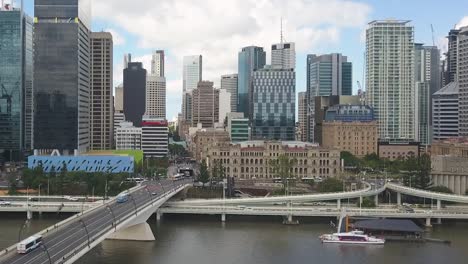 Drone-rise-and-pan-over-to-the-city-of-Brisbane-Australia-on-a-cloudy-day