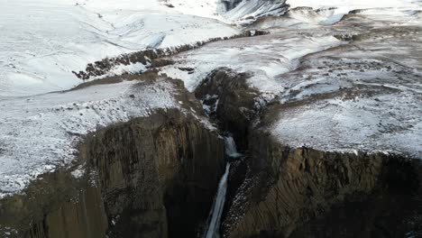 Litlanesfoss-in-the-morning-during-the-winter-in-Iceland,-aerial