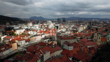 Cinematic-Drone-View-of-Franciscan-Church-of-the-Annunciation-and-Ljubljana-City-Center-in-Cloudy-Weather