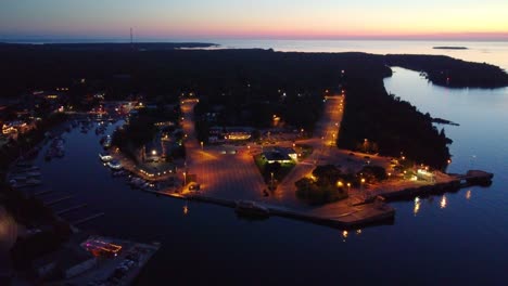 Night-aerial-view-over-the-beautifully-illuminated-Georgian-Bay,-Ontario,-Canada