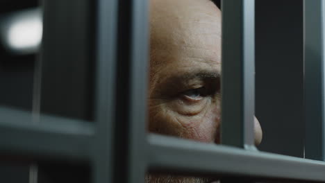 Close-Up-of-Elderly-Prisoner-Eating-Food-in-Prison-Cell----------(Stock-Footage)