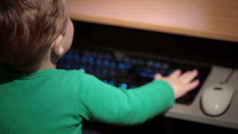Two-year-old-boy-is-playing-with-keyboard