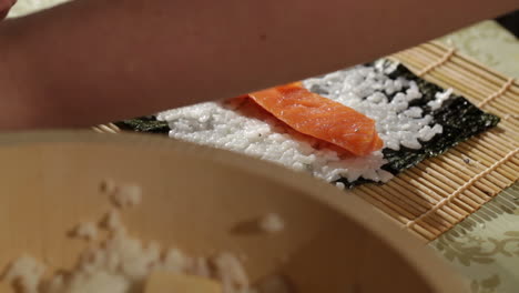 Making-sushi-rolls-with-salmon-and-philadelphia-cheese