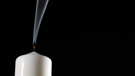Extinguished-candle-with-beautiful-dancing-smoke