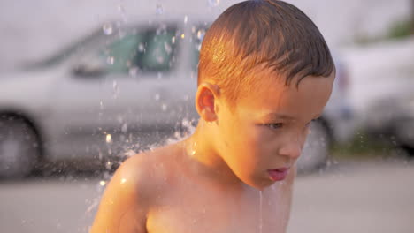 Child-taking-outdoor-beach-shower