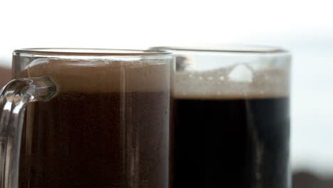 Pouring-black-beer-into-the-beer-cup